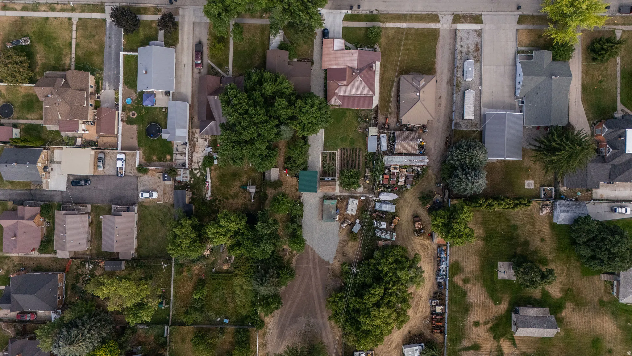 Aerial perspective showcasing multiple properties and street layouts
