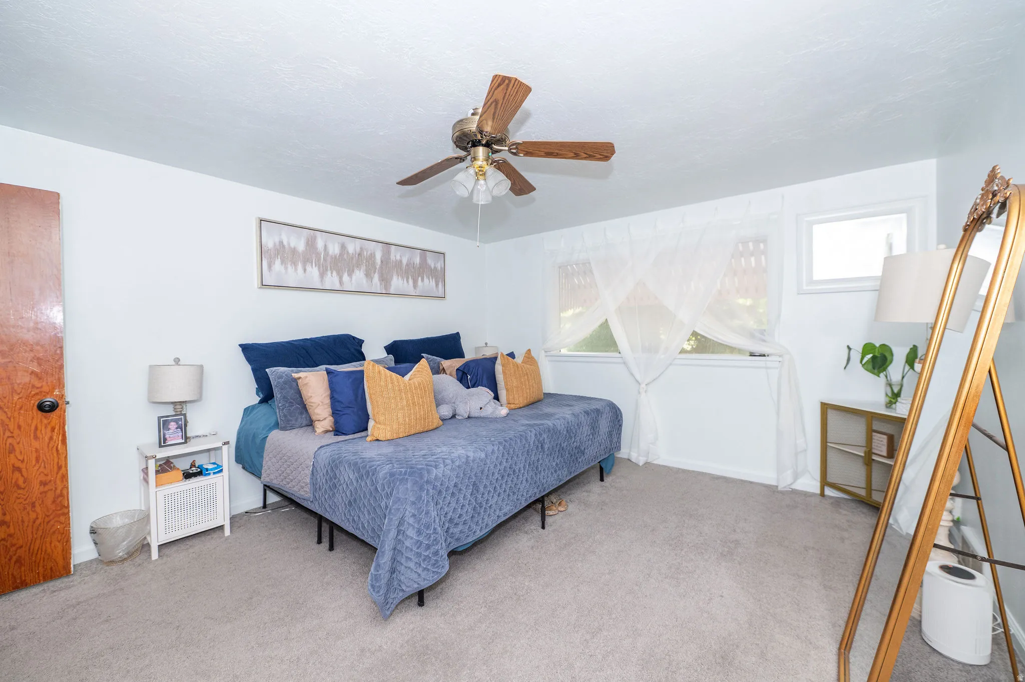 Room featuring light-colored carpeting and white wall finishes