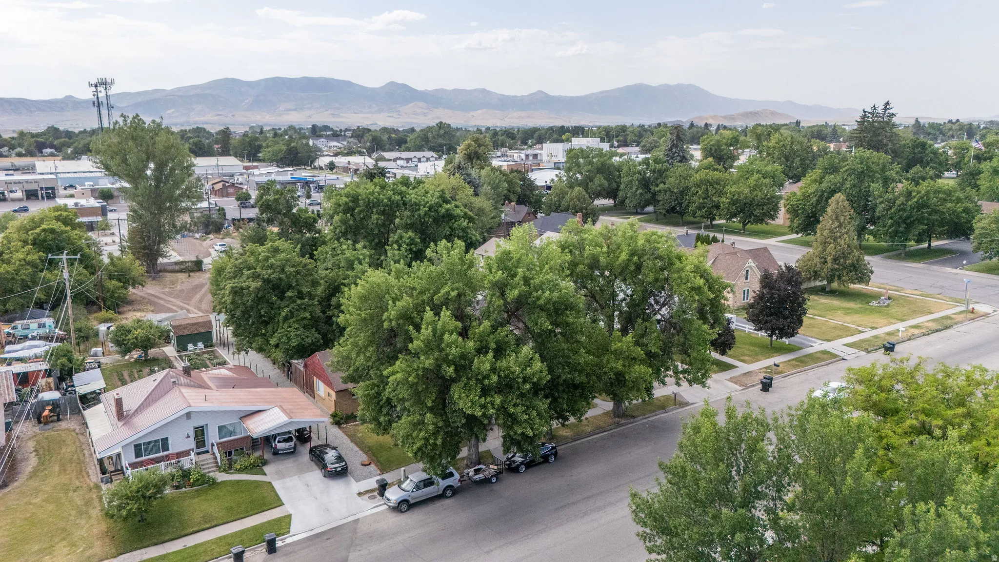 Aerial perspective showcasing a residential neighborhood with distant mountains
