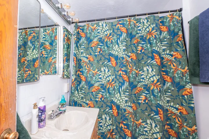 Bathroom featuring a built-in vanity with an integrated sink and chrome faucet