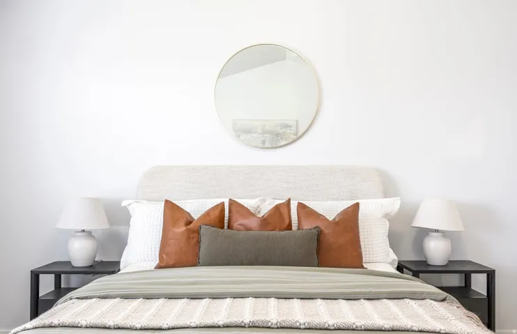 Neutral color palette with a textured headboard