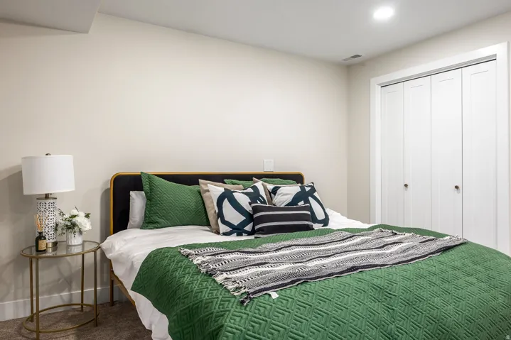 Bedroom featuring light neutral wall paint, recessed lighting, and carpet flooring