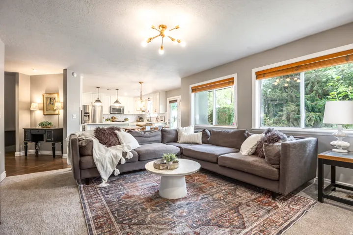 Spacious living area featuring abundant natural light from multiple windows