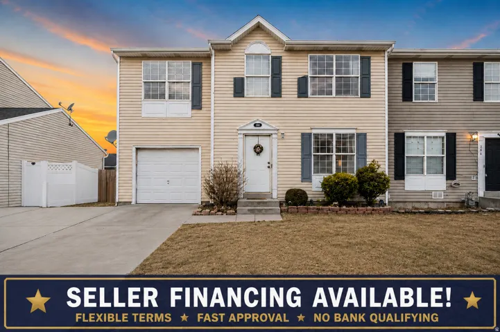 Two-story residential exterior featuring beige horizontal siding, a single-car garage, and a concrete driveway