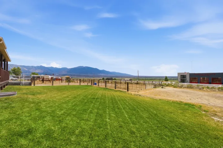Expansive green lawn with mountain backdrop