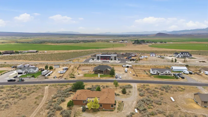 Expansive aerial perspective showcasing multiple properties amidst a rural setting