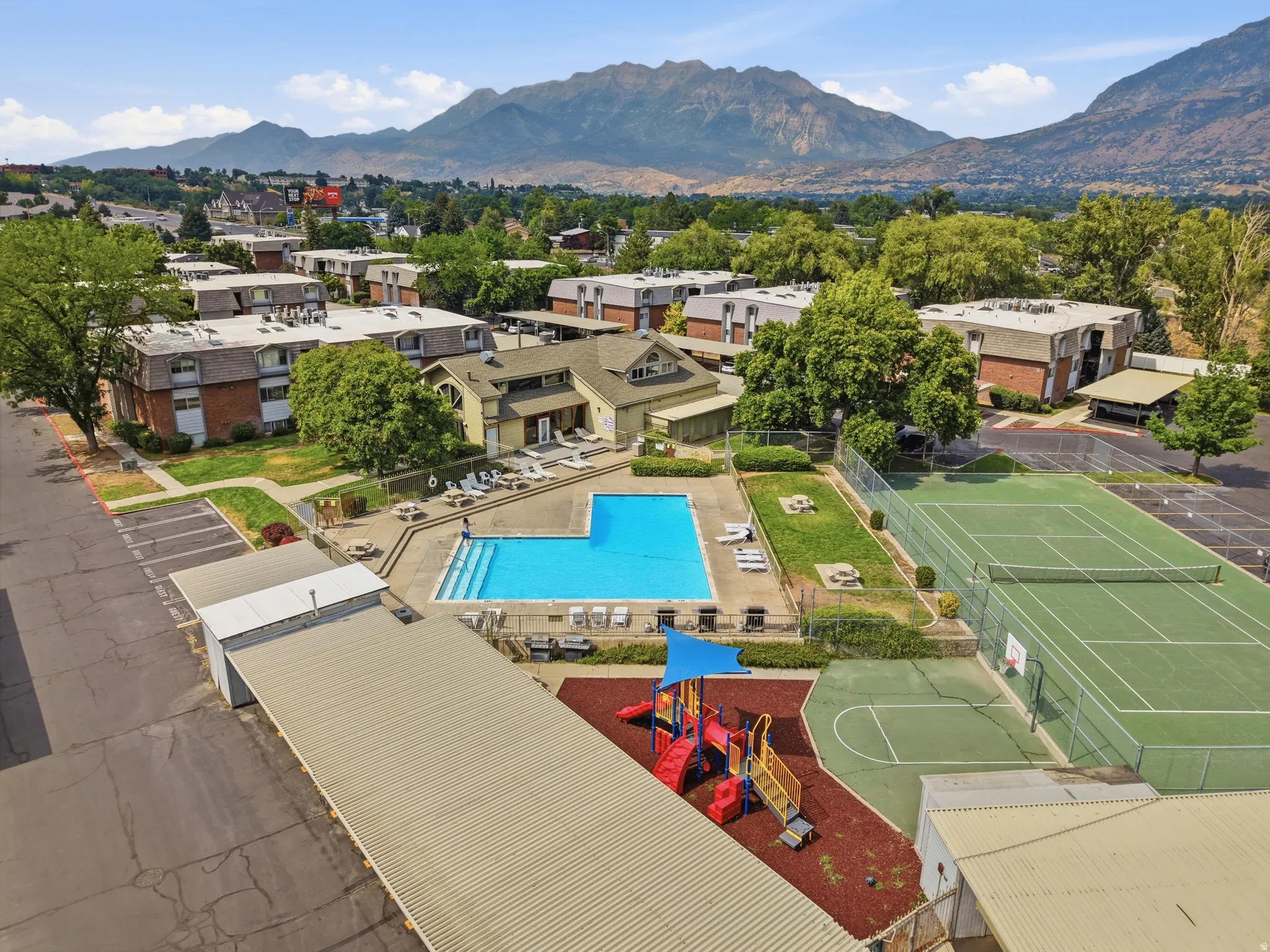 Community amenities featuring a swimming pool, tennis court, basketball court, and children's play area
