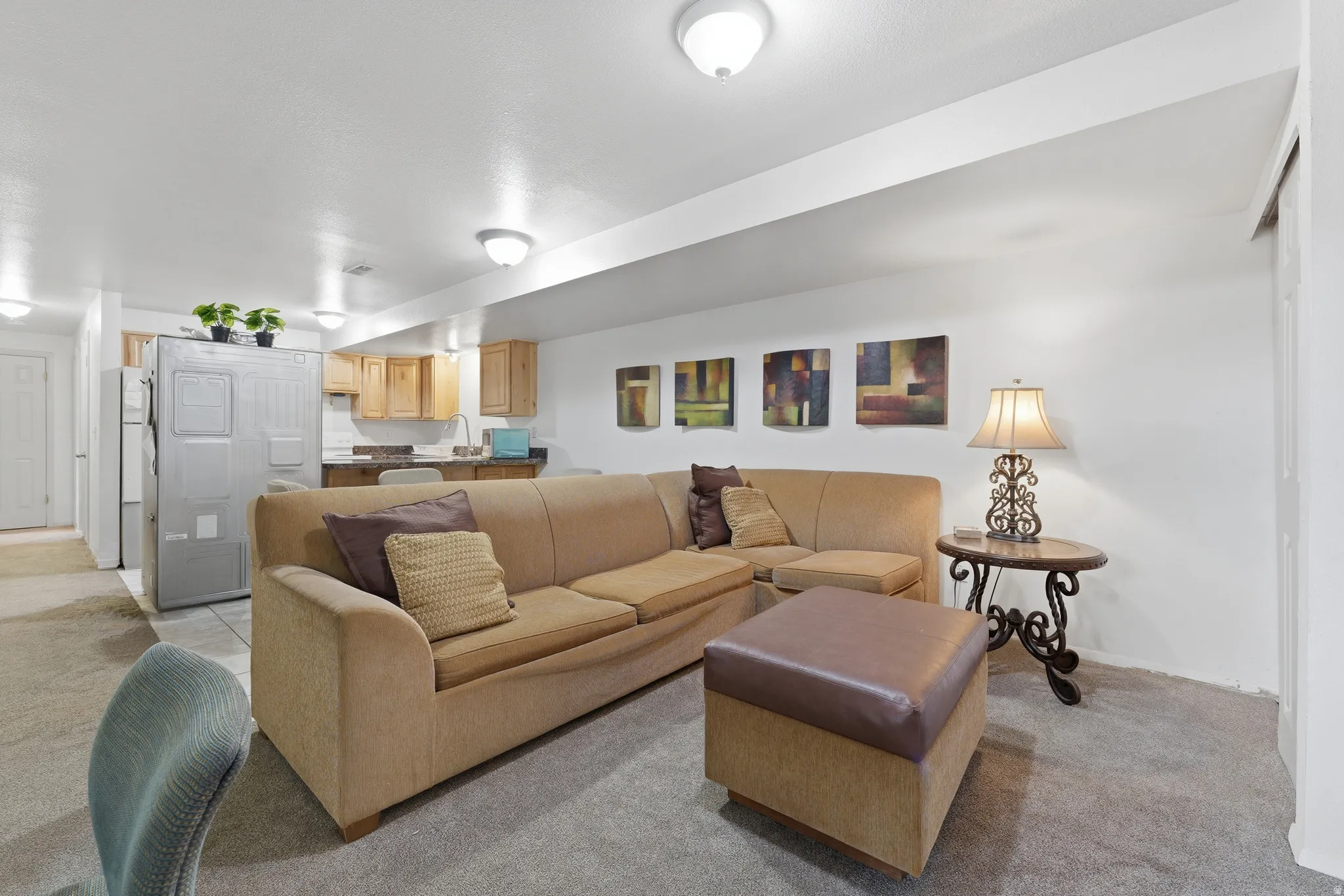 Open concept living area featuring recessed lighting and wall-to-wall carpeting