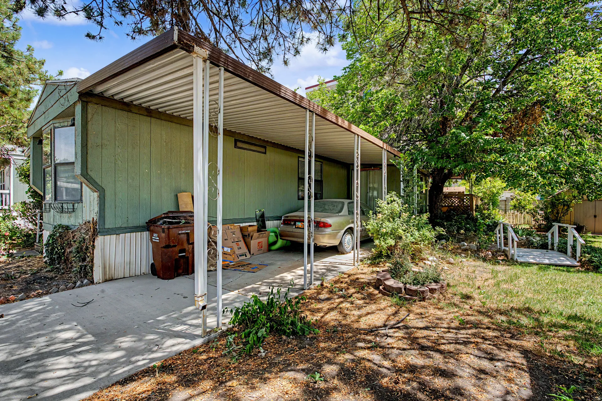 Carport with metal roofing and support columns