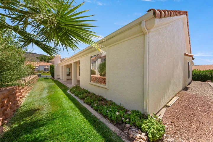 Exterior stucco finish with a terra cotta tile roof