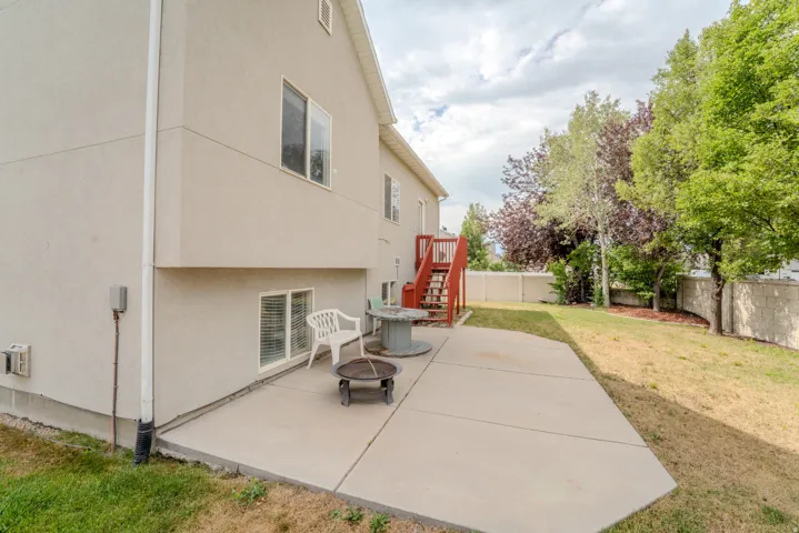 Rear exterior with a concrete patio