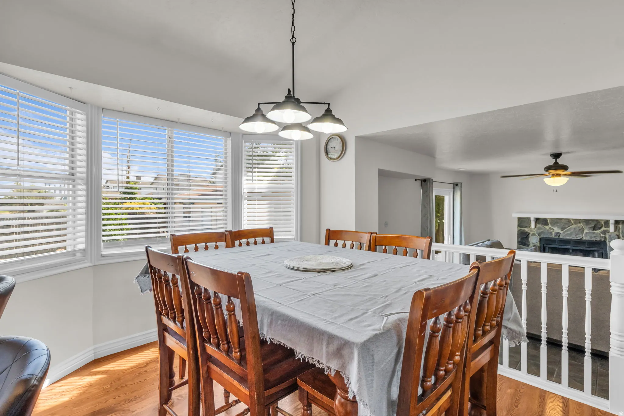 Dining area featuring wood-finish flooring and a multi-panel bay window