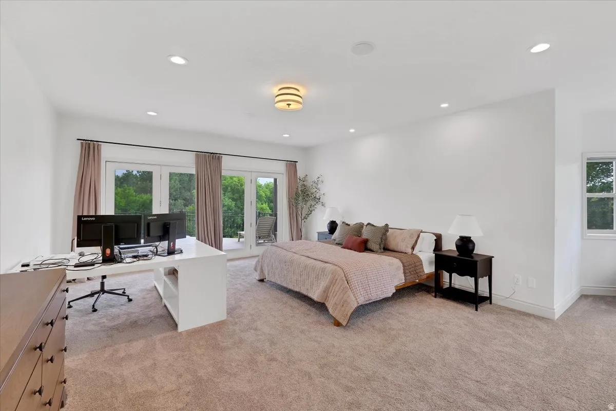 Spacious room with plush carpeting and recessed lighting