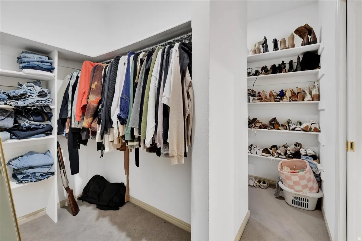 Custom closet system featuring shelving and hanging rods