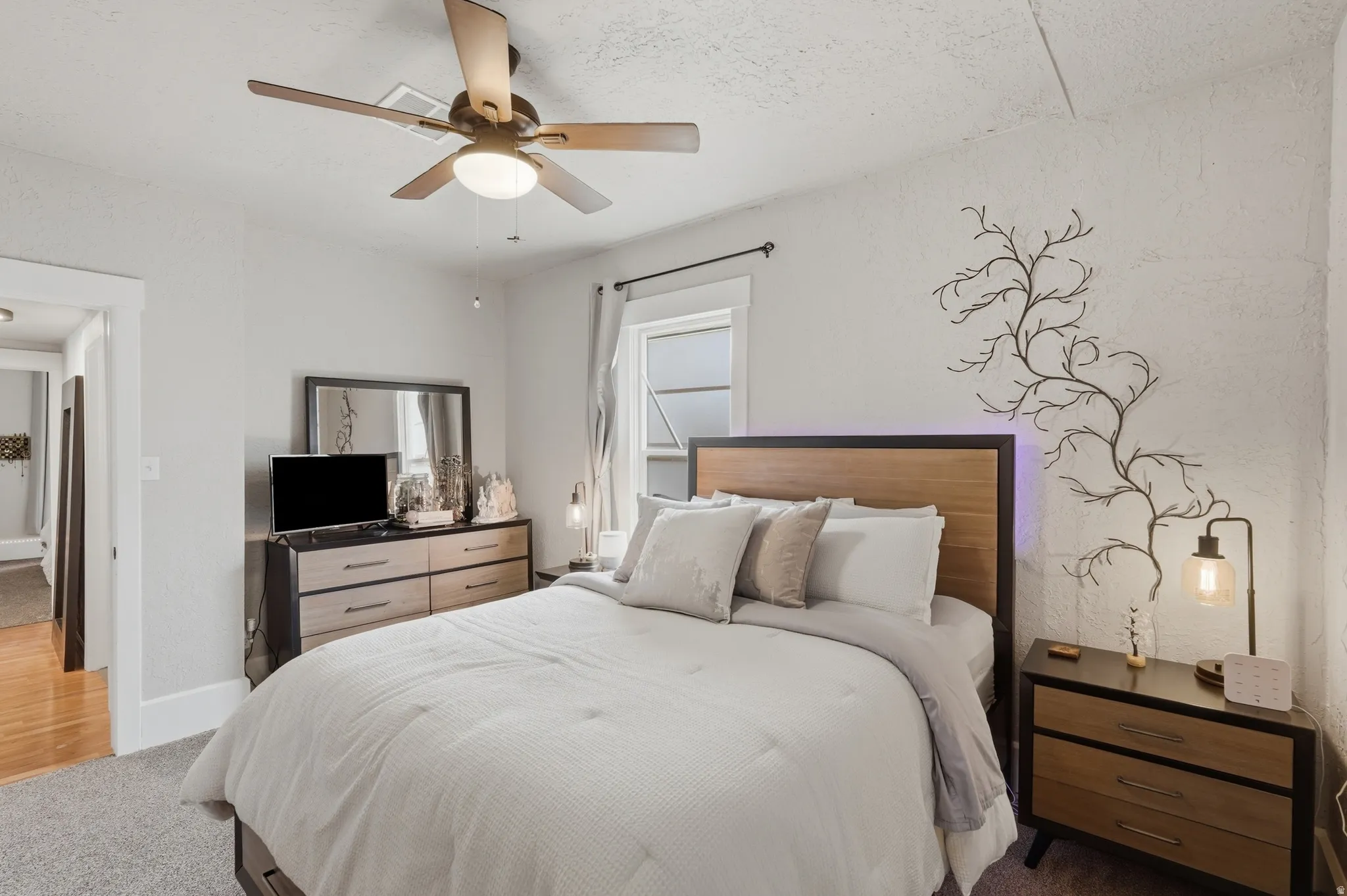 Bedroom featuring light gray walls and textured ceiling