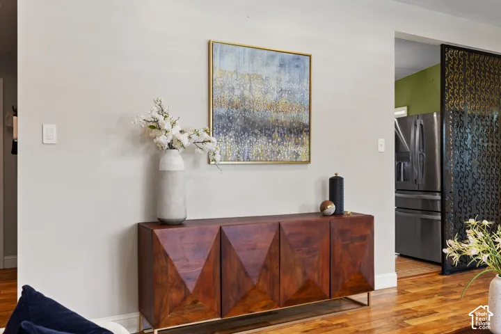Wood-finish flooring paired with a contemporary console cabinet