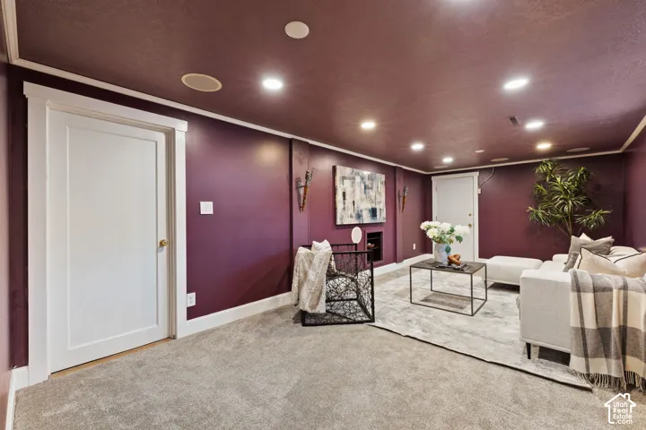Carpeted room with recessed lighting, white trim, and a built-in wall niche