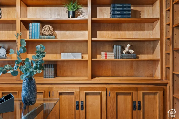 Built-in wood cabinetry featuring open shelving and enclosed storage