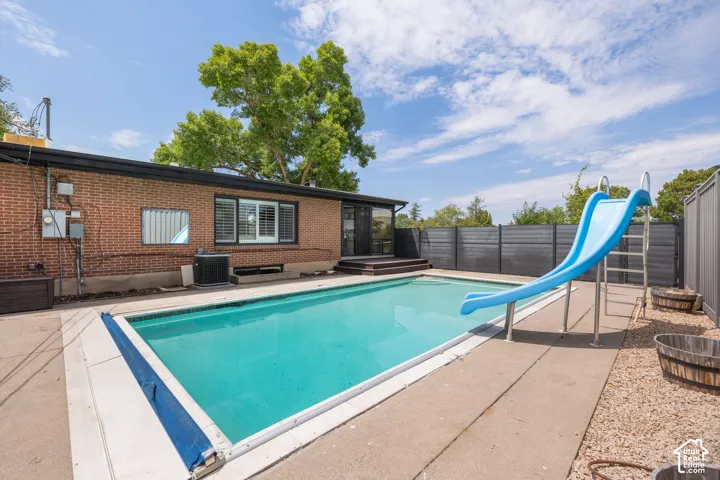 Outdoor swimming pool with concrete surround