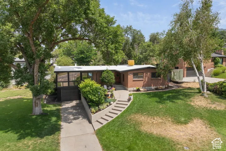 Brick facade residence with a flat roofline