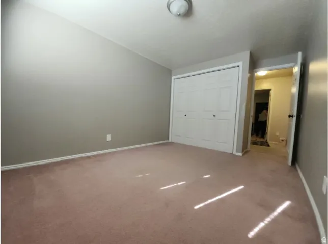 4th Bedroom, Neutral-toned walls complement the pink-hued carpeting