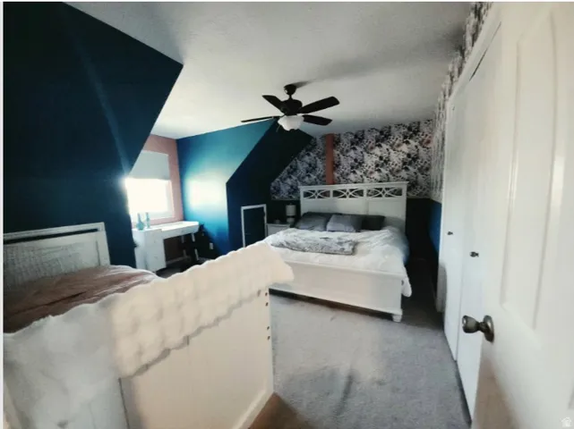 2nd Bedroom, Room featuring sloped ceilings, a window with roller shade, and light-colored carpeting