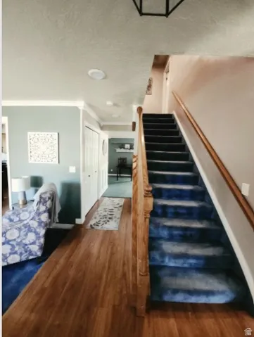 Stairs to 2nd floor, Wood-finish flooring throughout main Entry