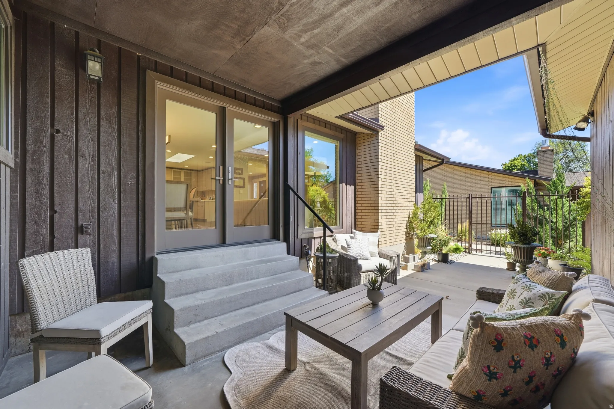 Covered patio terrace with large double doors for indoor outdoor living