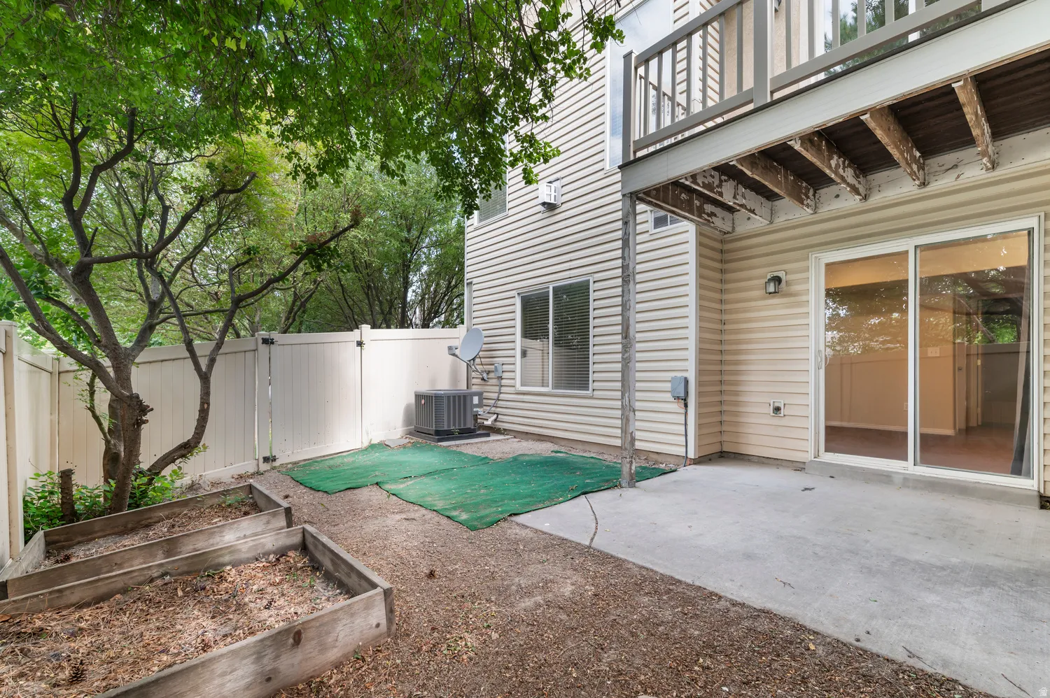 Rear patio with sliding glass door access
