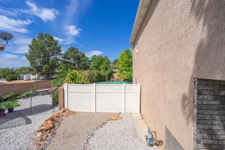 Stucco exterior with a decorative brick accent
