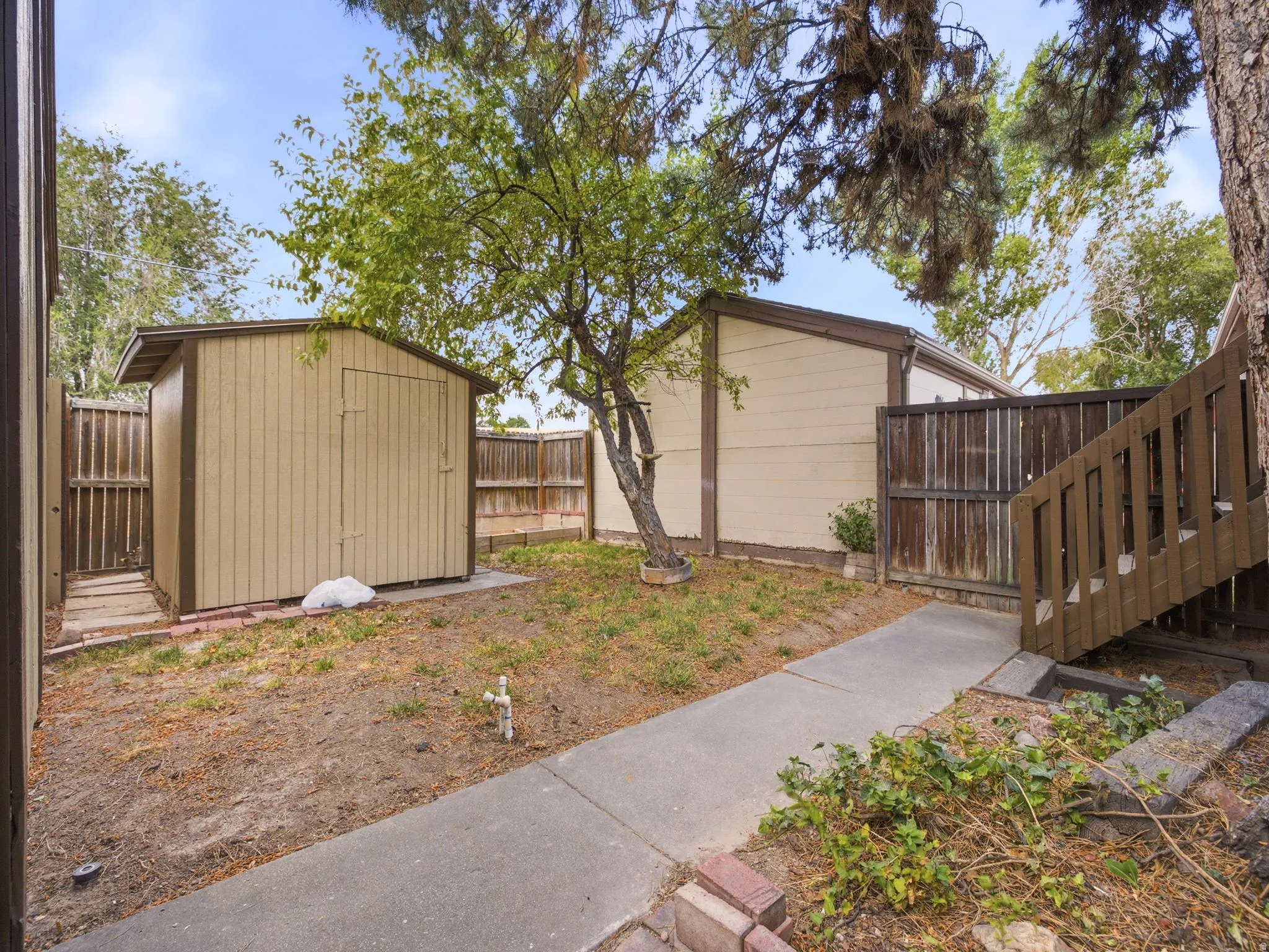 Exterior storage shed with vertical panel siding