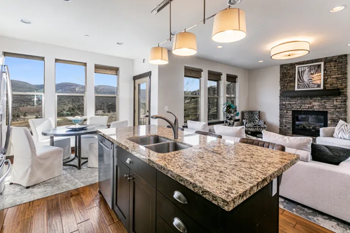 Kitchen island with granite countertop and double stainless steel sink