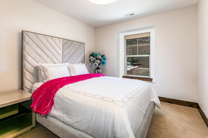 Cream walls framing a window with dark wood trim