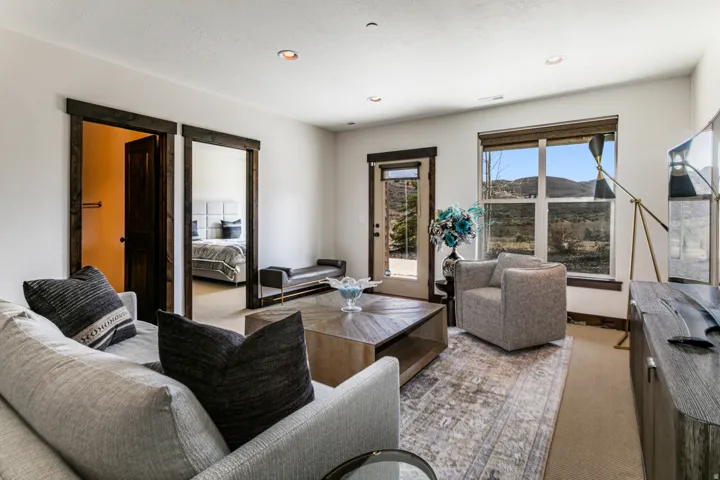 Living space with recessed lighting and a glass-paneled exterior door