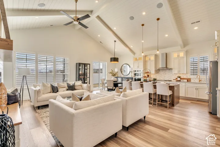 Vaulted ceiling with exposed beams and shiplap finish