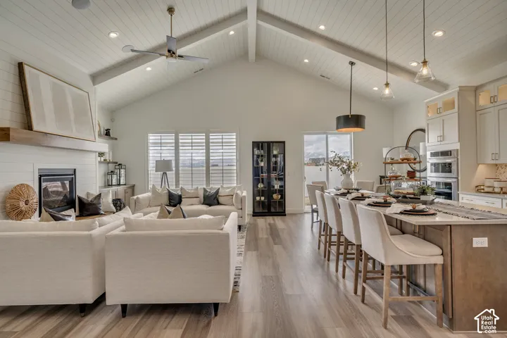 Vaulted ceiling with exposed beams and recessed lighting