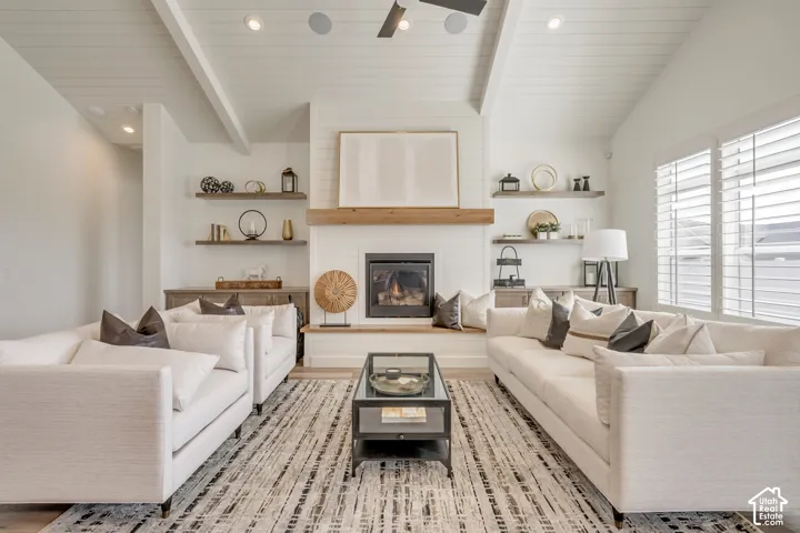 Vaulted ceiling with exposed beams and recessed lighting