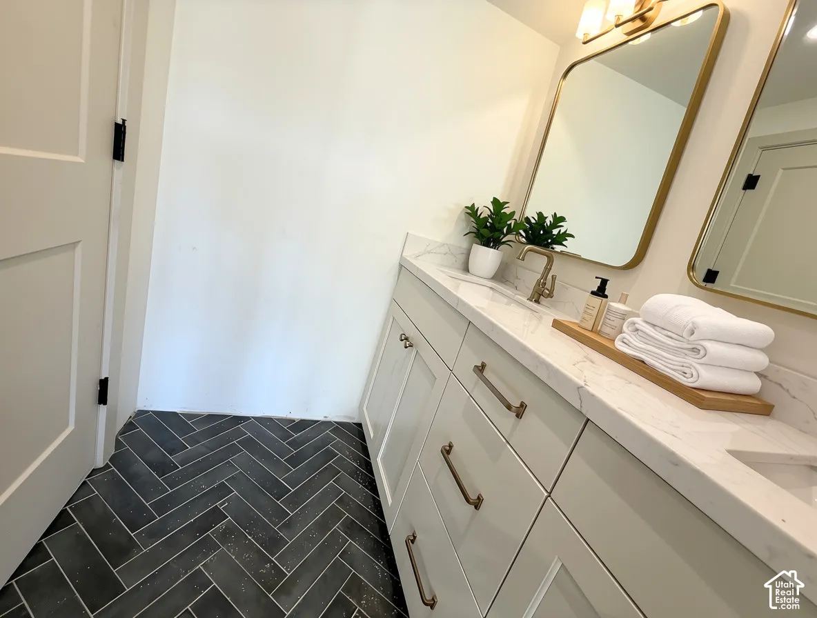 Double vanity with stone countertop and integrated sinks