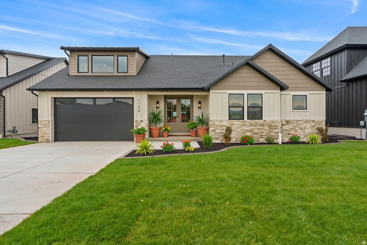 Contemporary exterior featuring a combination of stone veneer, vertical siding, and horizontal siding
