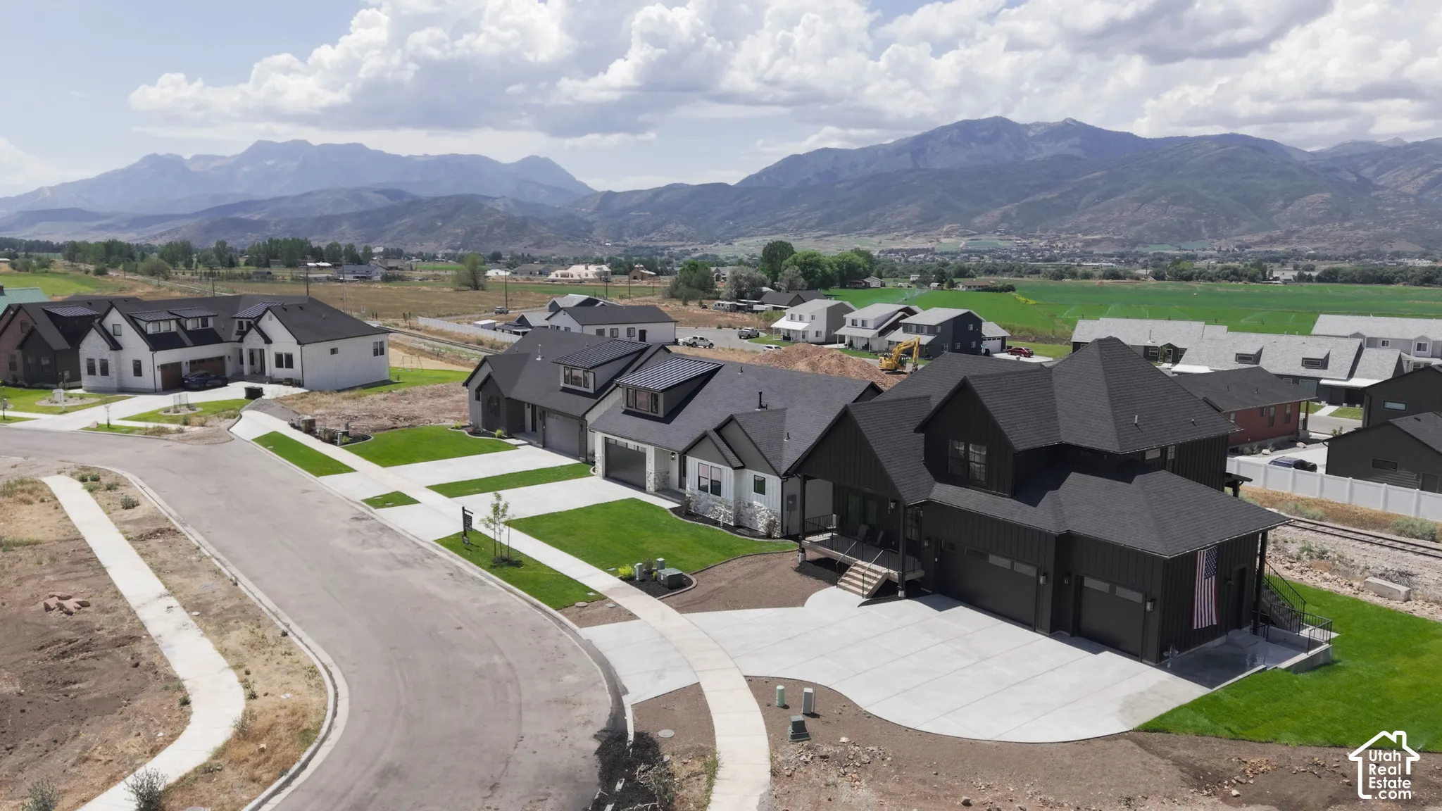 Modern residential development featuring single-family homes with mountain scenery