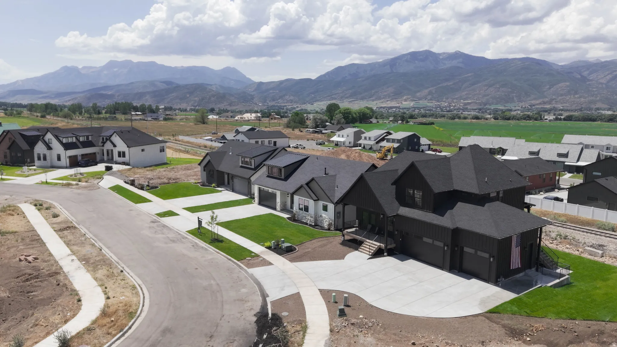 Modern residential development featuring single-family homes with mountain scenery