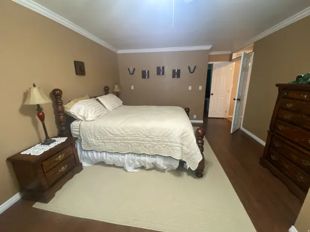 Primary bedroom with double doors to the hall way.