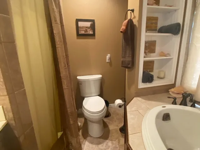 Primary bath showing  separate shower.