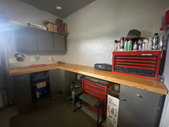Dedicated workbench area featuring wood-finish countertops