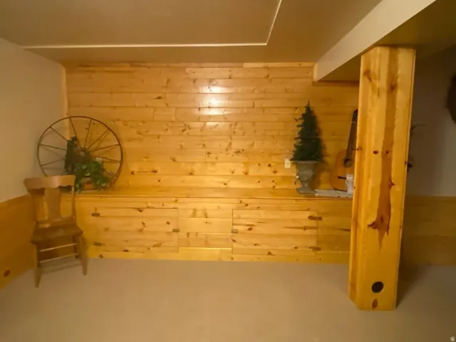 Wood-paneled wall with integrated storage bench