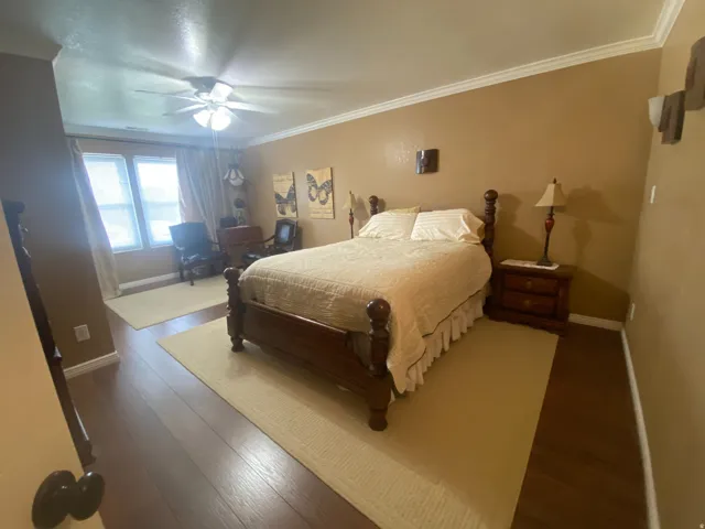Primary bedroom with view of the large window.