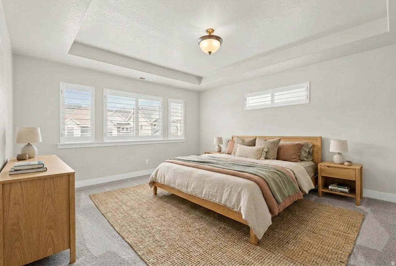 Recessed tray ceiling with central flush mount lighting fixture. Virtually staged.
