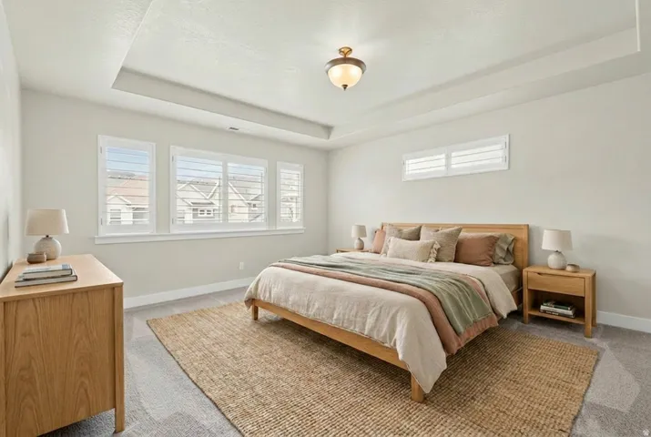 Recessed tray ceiling with central flush mount lighting fixture. Virtually staged.