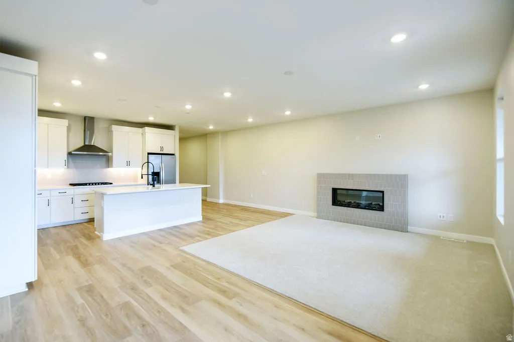 Open-concept living area featuring a modern kitchen and living room