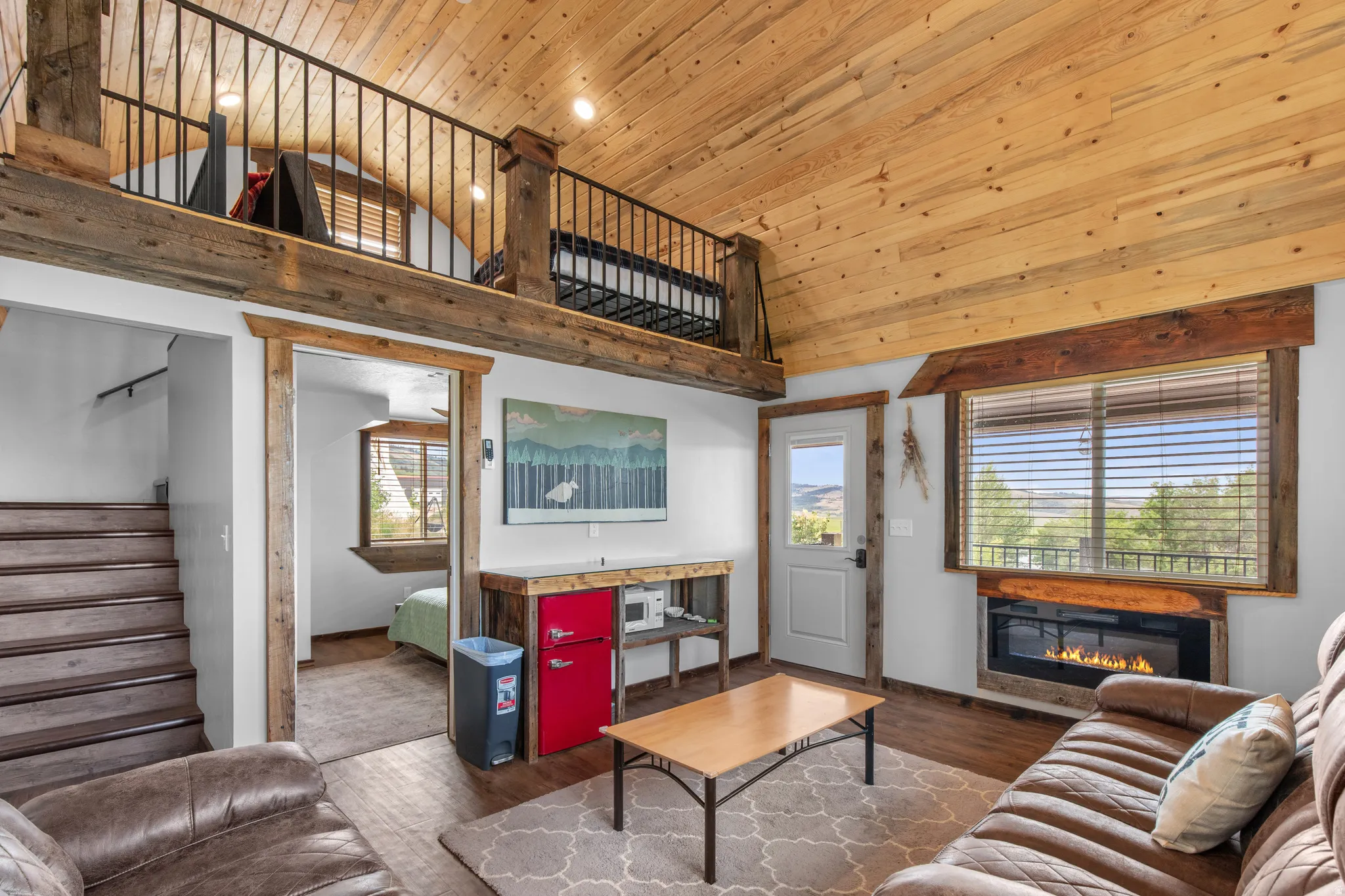 Vaulted wood-finish ceiling with exposed beams